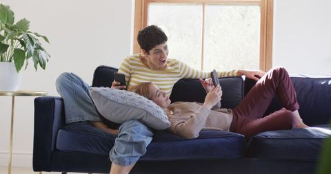 Relaxed Same-Sex Couple Enjoys Digital Devices at Home - Download Free Stock Images Pikwizard.com