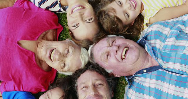 Extended Family Lying in Circle Outdoors Enjoying Happiness - Download Free Stock Images Pikwizard.com