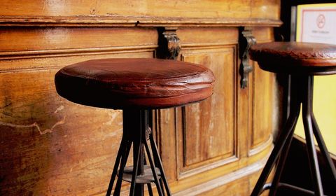Vintage Bar Stools Against Rustic Wooden Counter