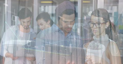 Diverse Team Collaborates on Financial Data in Modern Office