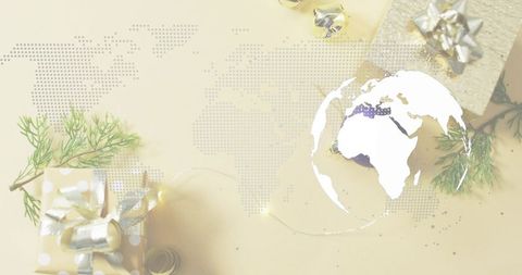 Displaying white globe silhouette over dotted world map with festive gifts and greenery