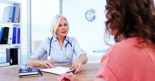 Experienced Female Doctor Consulting with Middle Aged Female Patient in Office - Download Free Stock Images Pikwizard.com