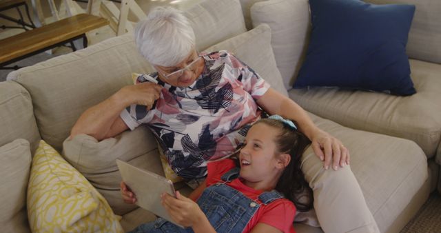 Grandmother and granddaughter bonding while using tablet - Download Free Stock Images Pikwizard.com