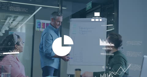 Diverse Team Collaborating in Modern Office with Digital Graphics Overlay