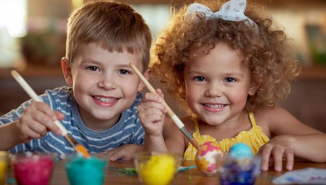 Children joyfully painting easter eggs in home kitchen setting