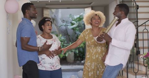 Friends Laughing and Enjoying Casual Gathering at Home