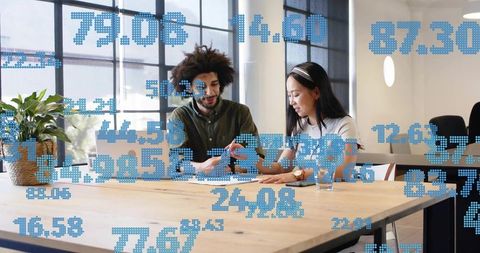 Collaborating over data-driven reports in modern office with digital analytics overlay