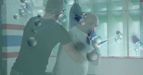 Rehab trainer guiding client through mobility exercises with network overlay
