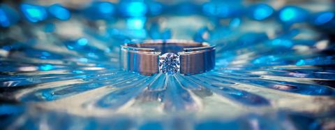 Engagement Ring Focused in Vibrant Blue Surrounding