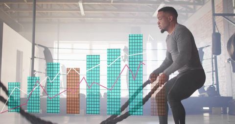 High-intensity battle rope workout with performance chart overlay in industrial gym studio
