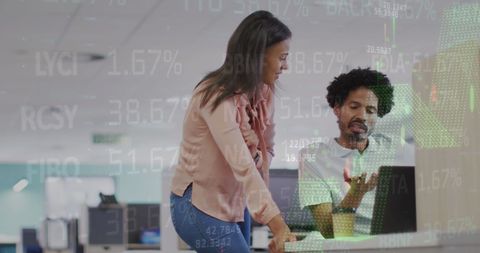 Diverse Team Analyzing Financial Data Projection in Modern Office