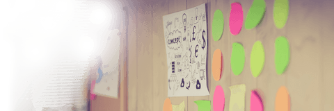 Transparency in brainstorming: adhesive notes and charts in office interior