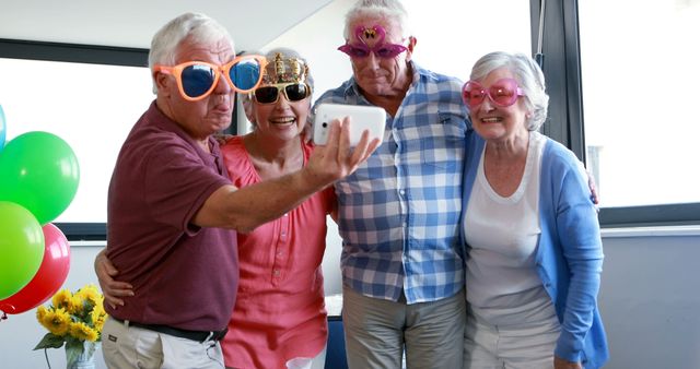 Seniors Wearing Funny Glasses Having Fun Taking Selfie Together - Download Free Stock Images Pikwizard.com