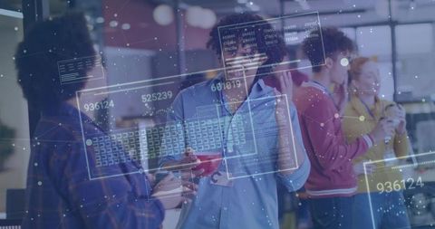 Tech Professionals Discussing Data in Modern Office Lounge