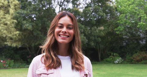 Smiling Woman Enjoying Peaceful Garden Retreat
