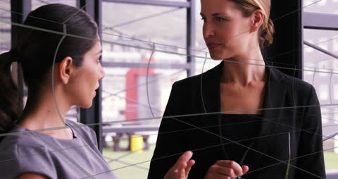 Diverse Businesswomen Discussing in Modern Office Setting
