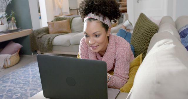 Young Woman Relaxing at Home While Using Laptop on Sofa - Download Free Stock Images Pikwizard.com