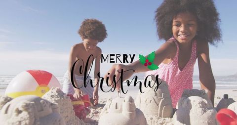 Joyful Siblings Building Sandcastles on Tropical Christmas Beach
