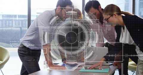 Business team collaborating over analytics dashboard with futuristic hud overlay