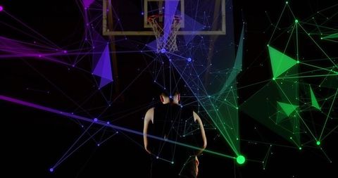Athlete Engages with Futuristic Digital Basketball Interface