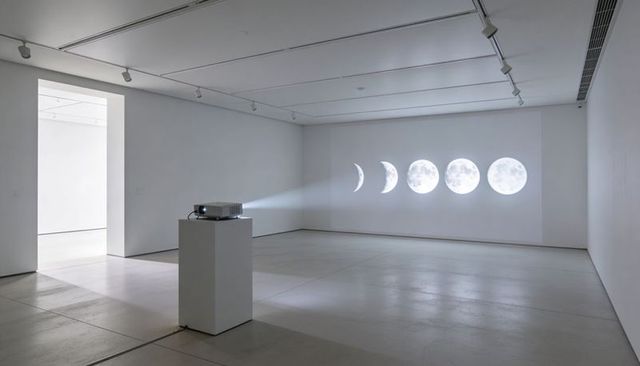 Projecting Moon Phases Across Minimalist Gallery Wall, Lunar Projection Art Installation
