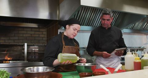 Chefs Perfecting Recipes in Contemporary Professional Kitchen - Download Free Stock Images Pikwizard.com