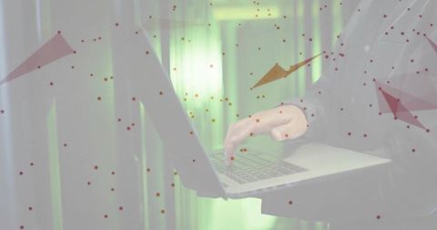 Korean it professional typing on laptop in data center with futuristic digital overlays