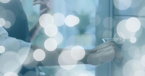 Medical Professional Writing on Glass Board in Clinic with Overlay