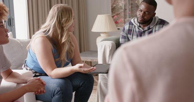 Diverse Group Discussion in Warmly Lit Living Room - Download Free Stock Images Pikwizard.com