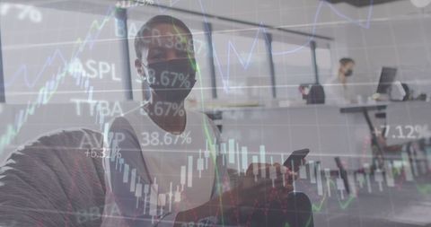 Masked Businesswomen Engaged in Financial Data Analysis