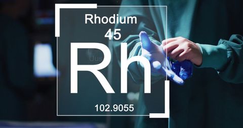 Caucasian Doctor Prepping with Rhodium Chemical Symbol Overlay