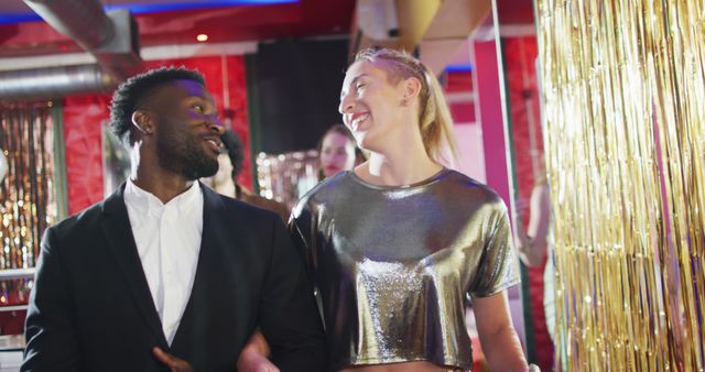 Interracial Couple Enjoying Nightclub Scene with Joyful Atmosphere - Download Free Stock Images Pikwizard.com