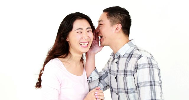 Man Whispering Secret in Woman's Ear with Joyful Expression - Download Free Stock Images Pikwizard.com