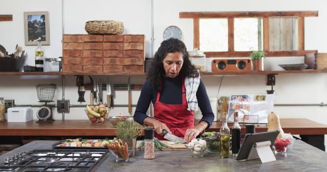 Woman in Red Apron Cooking in Rustic Kitchen - Download Free Stock Images Pikwizard.com