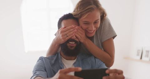 Playful Couple Taking Selfie at Home on Weekend