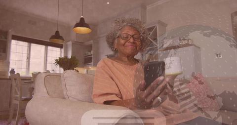 Elderly Woman Engaging with AI through Smartphone at Home