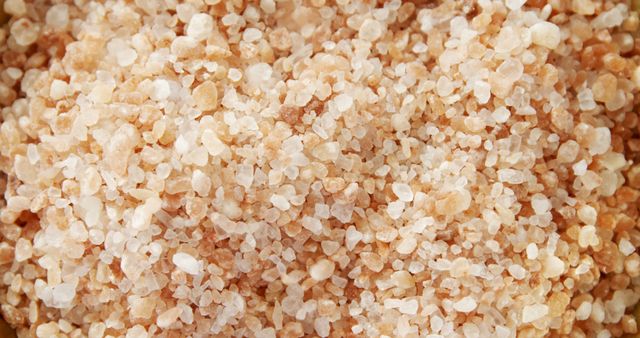 Close-up view of coarse Himalayan pink salt, showcasing its unique color and texture - Download Free Stock Photos Pikwizard.com