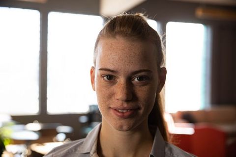 Confident Young Woman in Modern Office
