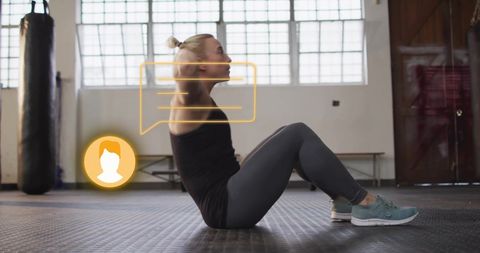 Woman exercising with digital fitness interface for workout tracking