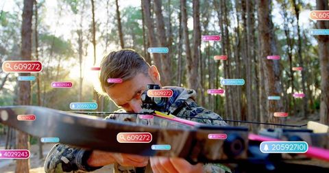 Aiming compound bow with scope in sunlit forest featuring ar data tags and camouflage