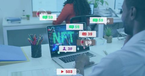 Working man viewing NFT dashboard with live social notifications on laptop in office