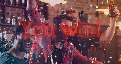 Friends Celebrating Victory With Beer in Bar