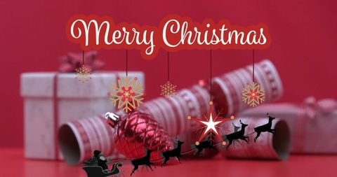 Festive Christmas Text with Party Poppers and Gift Boxes