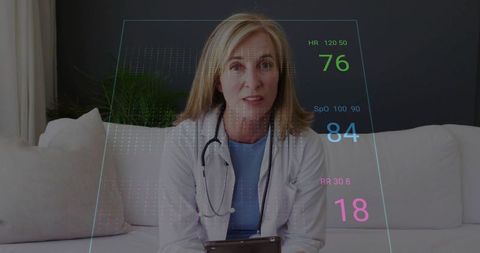 Female doctor analyzing digital health data display