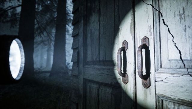 Flashlight revealing weathered double door with rusted handles and glowing portal in foggy forest
