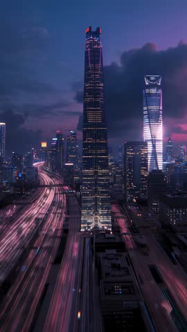 Vertical dusk city timelapse with glowing skyscraper and streaming highway light trails