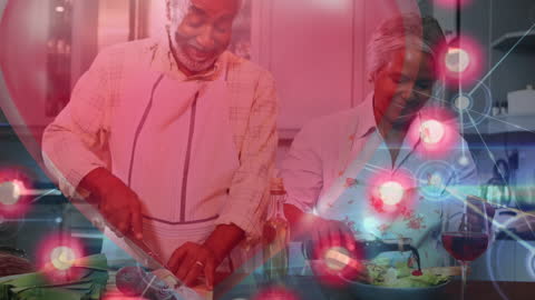 Senior Couple Cooking with Digital Network Overlay Concept