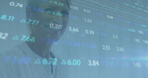 Smiling senior female executive viewing overlaid market data with digital double exposure