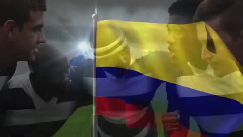 Diverse Rugby Players Huddling with Colombian Flag in Unity