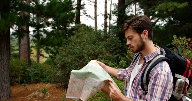 Male Hiker Reading Map in Forest - Download Free Stock Images Pikwizard.com